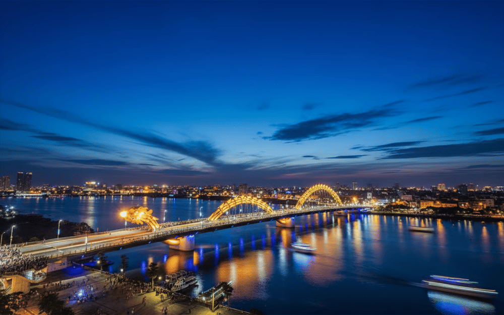 Dozens of cruise ships carry tourists to watch the Dragon Bridge fire show